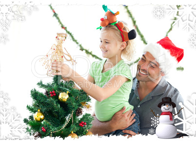 Cute little girl decorating the christmas tree with her father