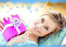Smiling woman holding a present