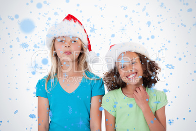 Cheerful girls with christmas hats