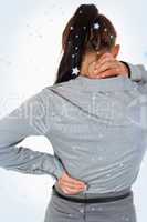 Portrait of the painful back of a young businesswoman