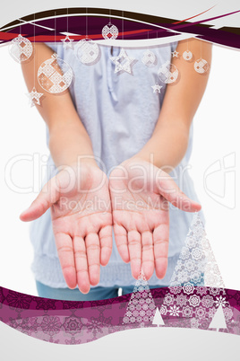 Composite image of casual young woman holding hands out