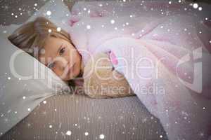 Composite image of young girl resting on sofa with stuffed toy