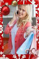 Pretty blonde smiling at camera holding shopping bags
