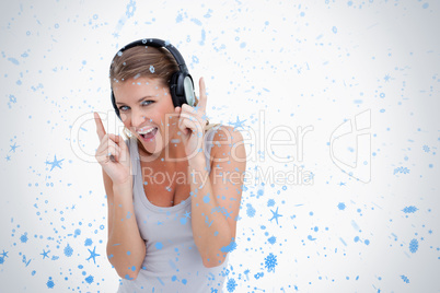 Cheerful woman dancing while listening to music