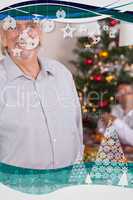 Happy grandfather standing at christmas