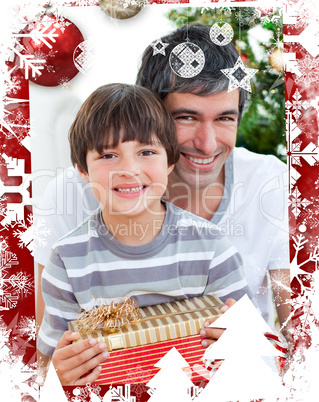 Composite image of father and son holding a christmas gift