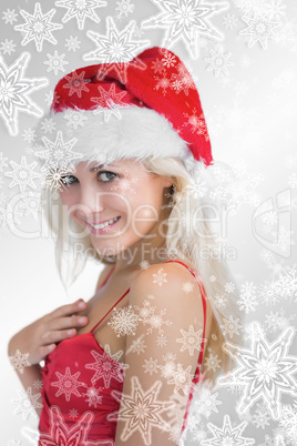 Happy young woman wearing santa hat