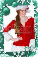 Composite image of pretty girl in santa costume smiling at camera