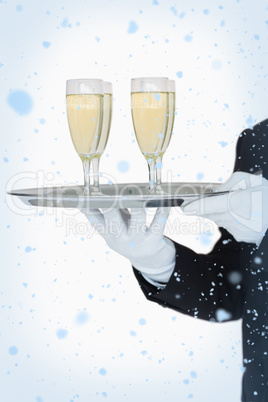 Waiter holding tray of champagne flutes