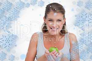 Smiling woman holding an apple