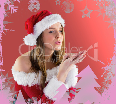 Pretty brunette in santa outfit blowing over hands