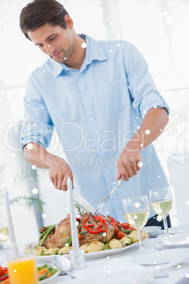 Attractive man carving the dinner