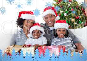 Composite image of family holding christmas presents