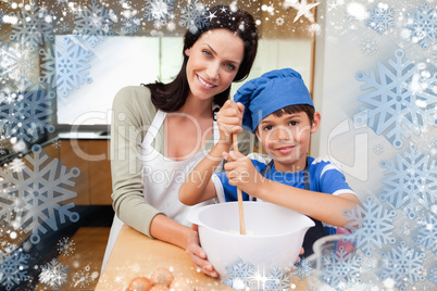 Composite image of mother and son having fun preparing dough