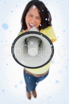 Close up of a megaphone holding by a young woman