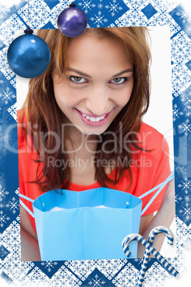 Teenager smiling after looking at her purchase bag