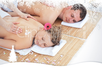 Beautiful young couple receiving a back massage