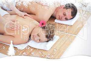 Beautiful young couple receiving a back massage