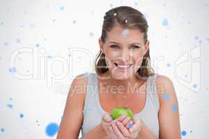 Smiling woman holding an apple