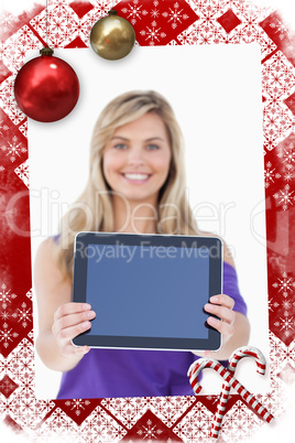 Composite image of tablet computer being held by a blonde woman