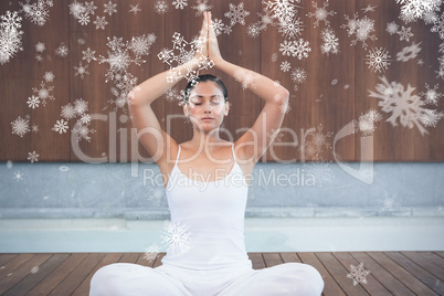 Peaceful woman in white sitting in lotus pose