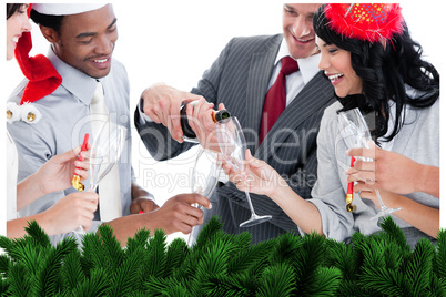 Business team drinking champagne to celebrate christmas