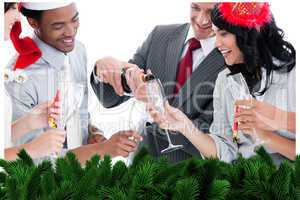 Business team drinking champagne to celebrate christmas