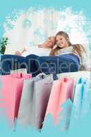 Composite image of smiling girls sitting on the couch with their