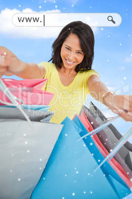 Woman showing her shopping bags under address bar