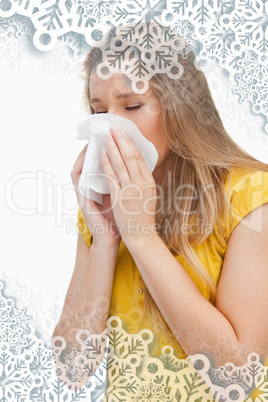 Close up of a blond woman blowing