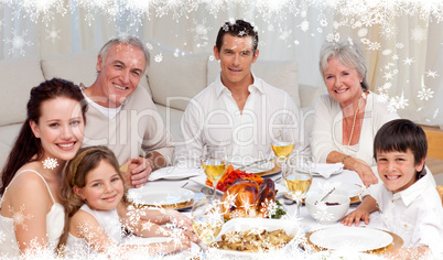 Composite image of family having a dinner together at home