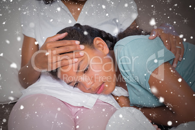 Composite image of sick daughter lying on mothers lap