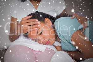 Composite image of sick daughter lying on mothers lap
