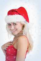 Happy young woman wearing santa hat