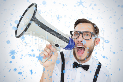 Geeky businessman shouting through megaphone