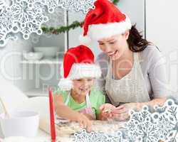 Lovely mother and daughter preparing christmas cookies