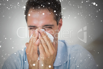 Composite image of closeup of a man suffering from cold