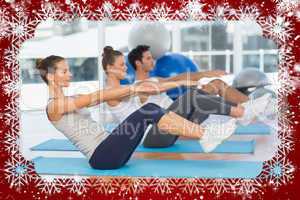 Class stretching on mats at yoga class