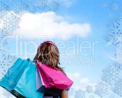 Woman holding shopping bags outdoor