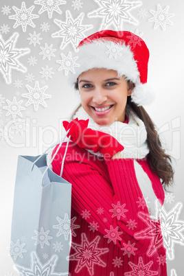 Beautiful festive woman holding shopping bag