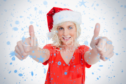 Smiling young woman putting her thumbs up in satisfaction