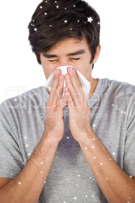 Man using a tissue to blow his nose