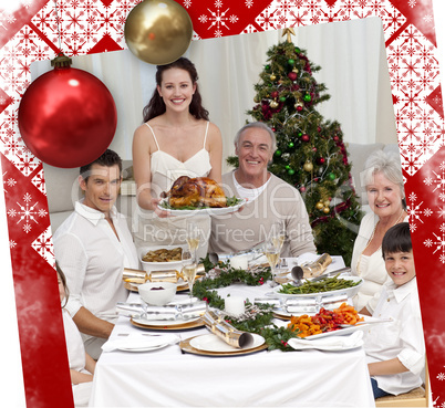 Family celebrating christmas dinner with turkey