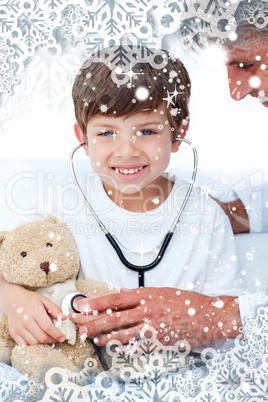 Adorable little boy playing with his doctor