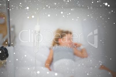 Composite image of sick girl in hospital bed