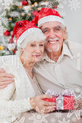 Happy couple on the couch at christmas