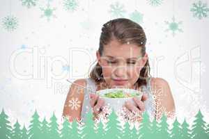 Composite image of woman smelling a salad