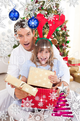 Surprised father and his girl opening christmas gifts