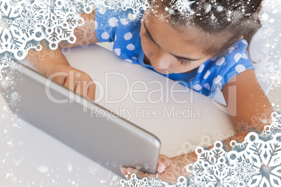 Close up of a girl using digital tablet on table