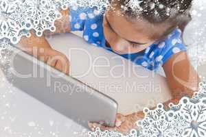 Close up of a girl using digital tablet on table